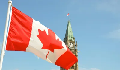 Peace tower with the Canadian flag in front